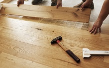 Installing wooden flooring planks step process