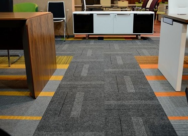 Charcoal carpet tiles Abu Dhabi office walkway design