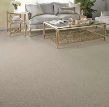Cream wall to wall carpet under coffee table