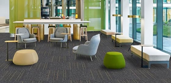 Grey carpet tiles in bright office lounge