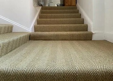 Herringbone sisal carpet installed on staircase and landing