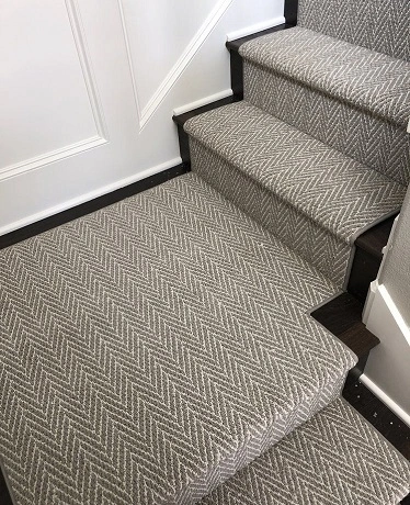 Herringbone wall to wall carpet staircase