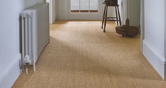 Natural sisal basketweave carpet installed in hallway entrance