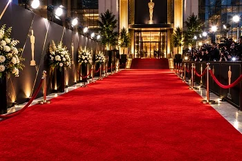 Red carpet awards ceremony entrance with rope barriers