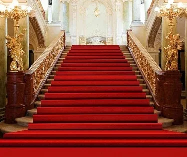 Red carpet stair runner on grand staircase