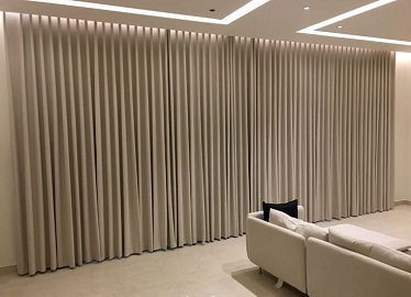 Wave-fold curtains in modern minimalist living room