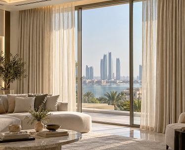 Linen curtains in a cream living room with waterfront skyline view