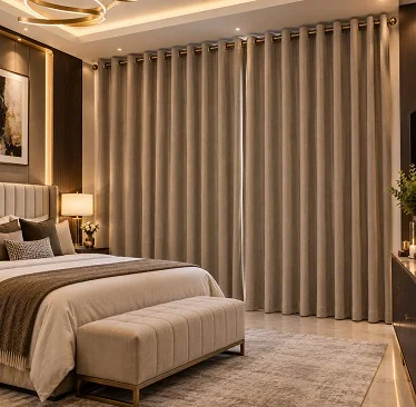 Taupe textured eyelet curtains in a warm, luxurious bedroom